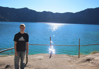 Matthew Axler standing in front of lake