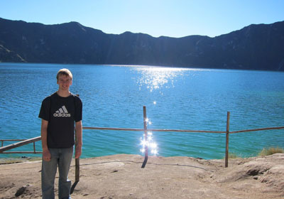 Matthew Axler standing in front of lake
