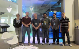 group of people standing in office